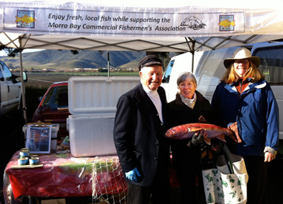 Captain Travis Evans and Margie Hurd at SLO Fresh Catch market booth