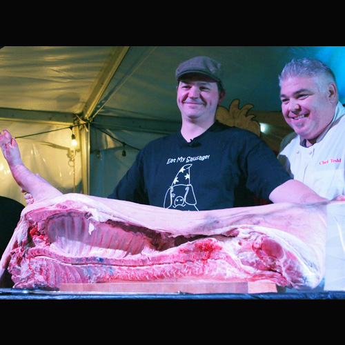 Pig Wizard and Chef Todd with half a pig